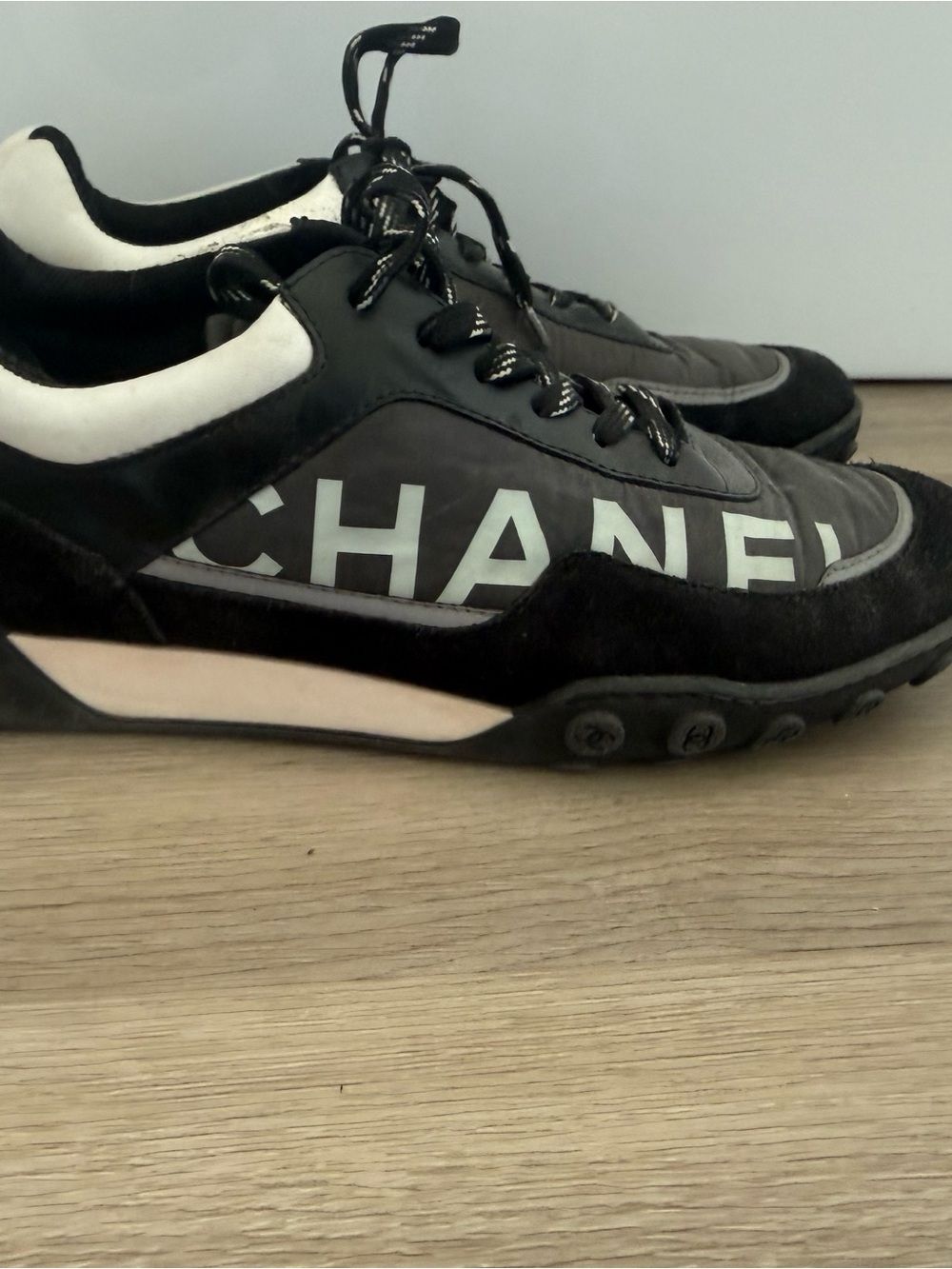 CHANEL Black and White Men’s Logo Running Sneakers